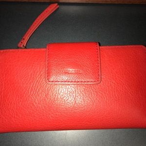 Red Fossil wallet. Hardly used.